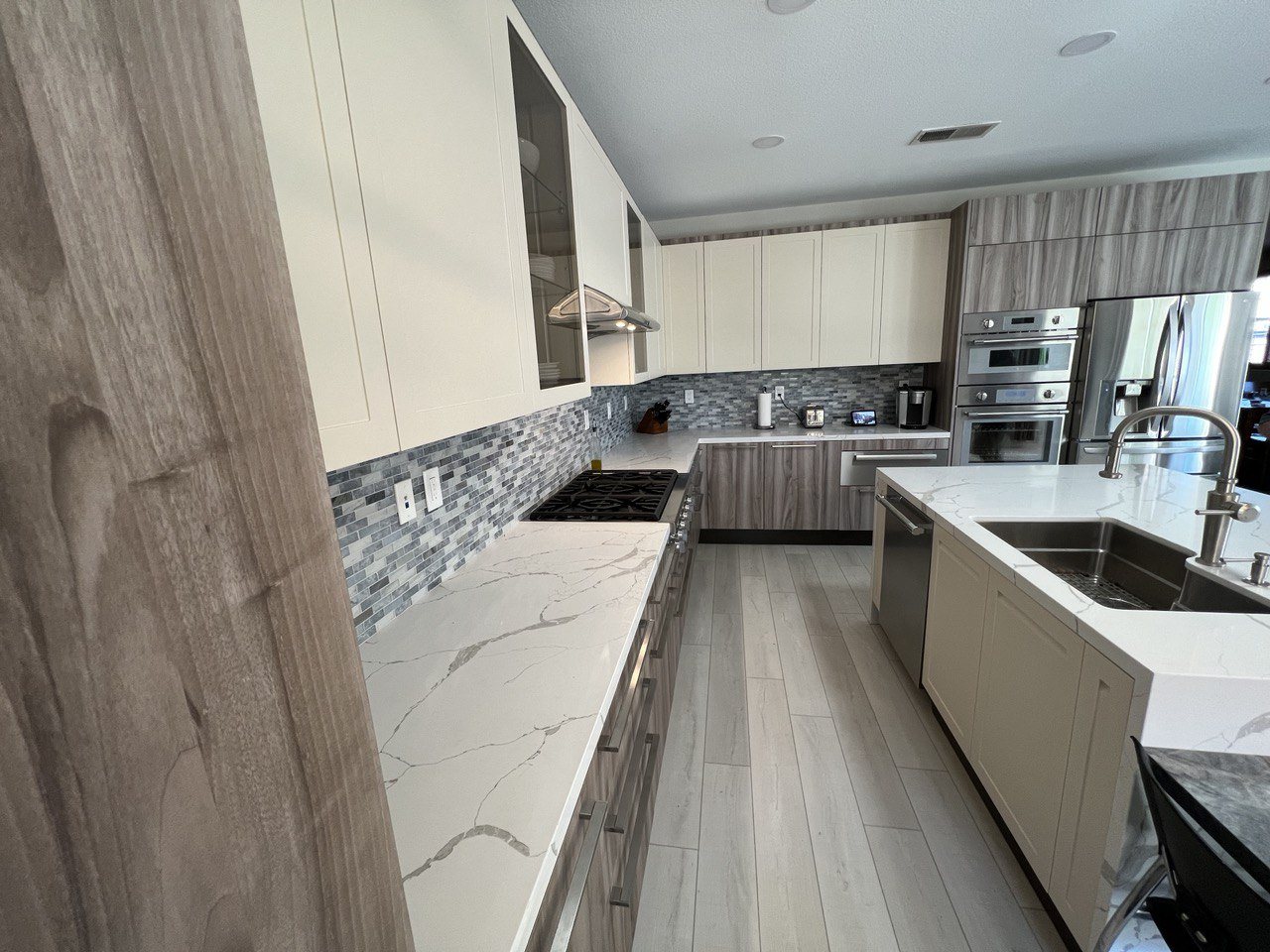Kitchen renovation with quartz counters and modern cabinetry